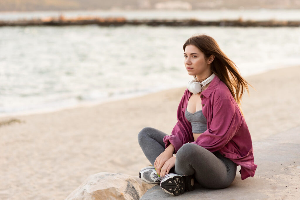 Person meditating outdoors, illustrating the mental health benefits of exercise