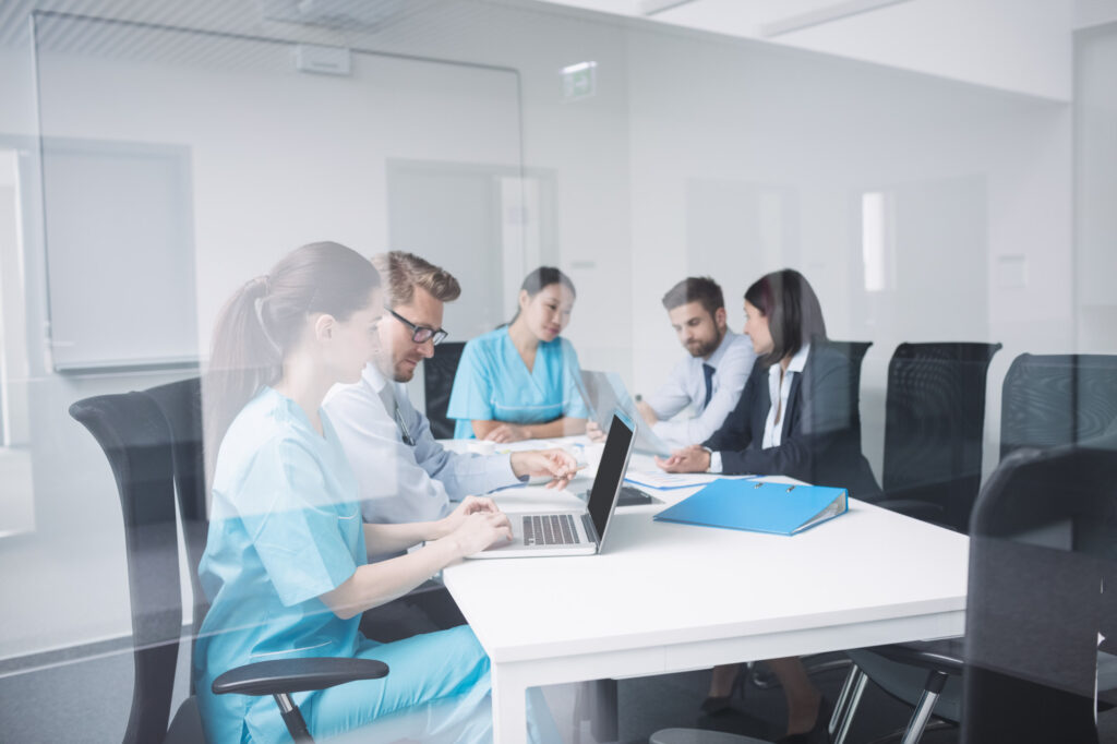 Healthcare professionals working in a collaborative office environment.